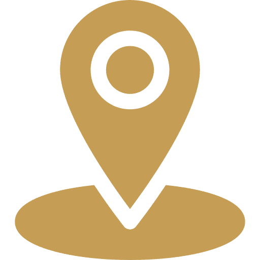 Ícono dorado de marcador de ubicación sobre una base ovalada, representando un punto de localización en un mapa.